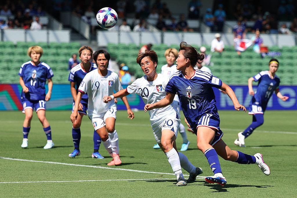 Japan player scoring against Chinese Taipei during the international football friendly